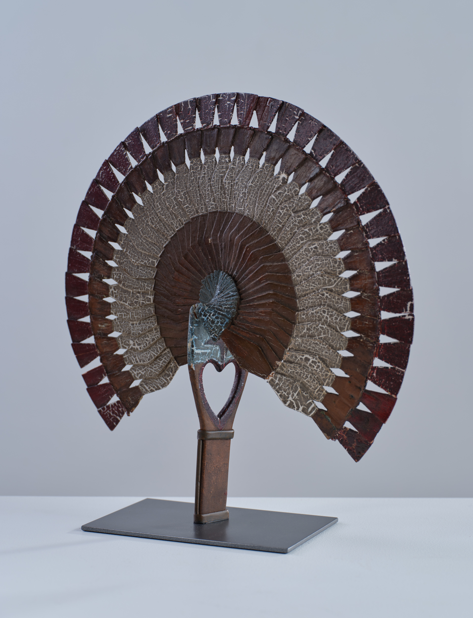 folk art carved fan rel=