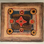 primitive geometric hooked rug