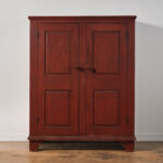 antique red two-door cupboard